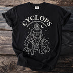 Black t-shirt with white illustration of a Cyclops, mountains, and stars.