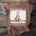 Brown t-shirt with "this actually is my first rodeo" and horse graphic.