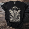 Black t-shirt with cream colored moth fairy, moon phases, and floral design.