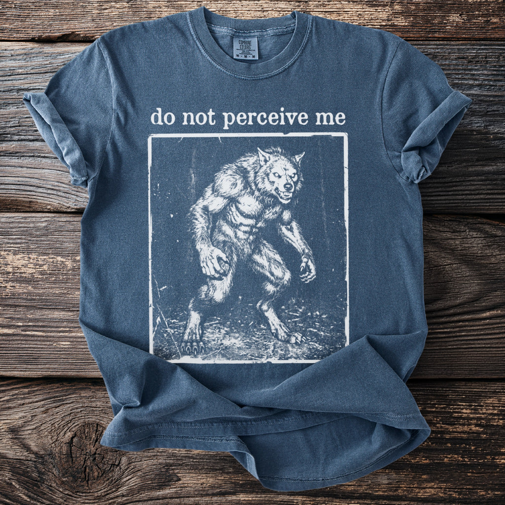 Blue t-shirt with text "do not perceive me" and a werewolf graphic.