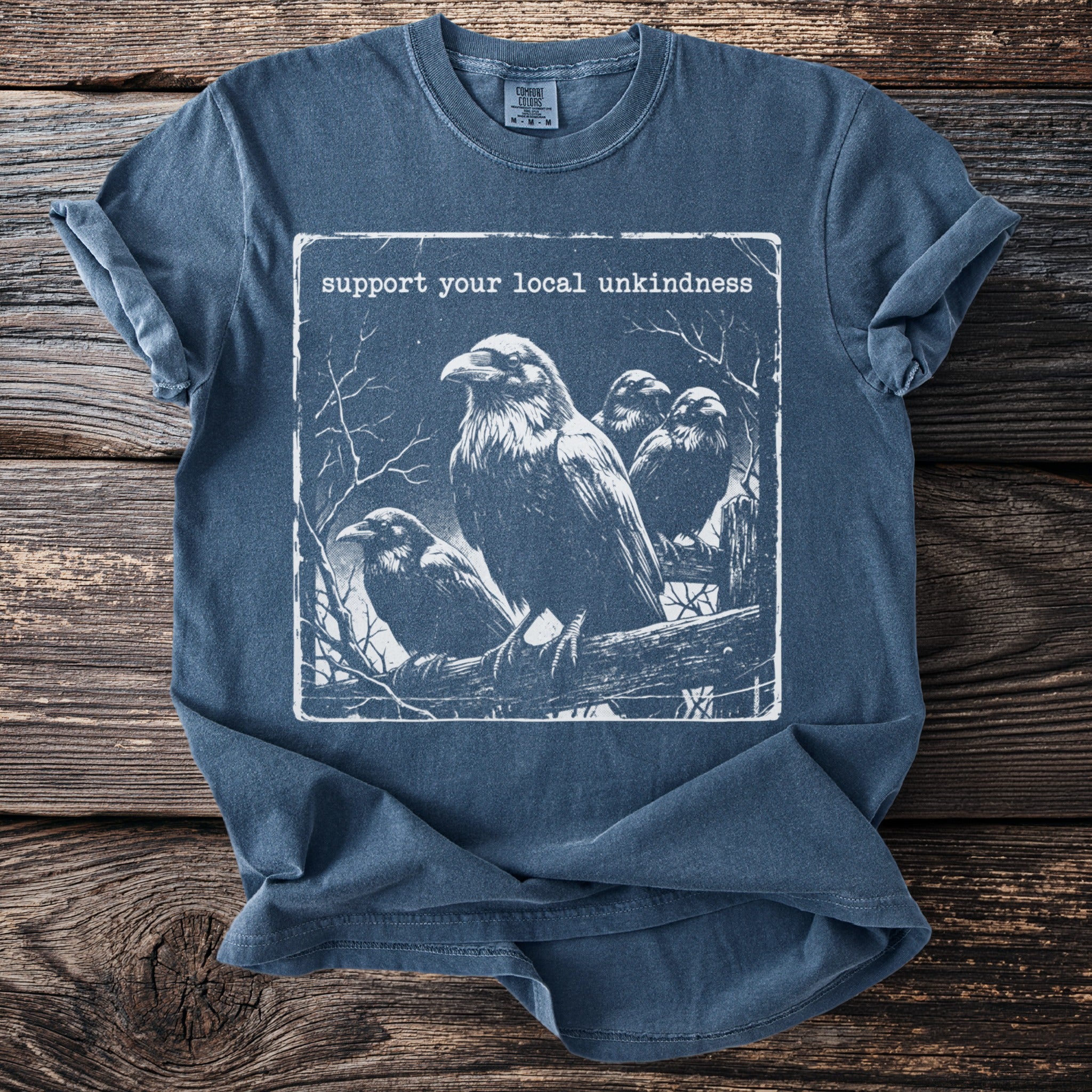 T-shirt with four ravens on a branch and text "support your local unkindness."