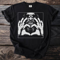 Black t-shirt with a graphic of a cyclops making a heart shape with its hands.