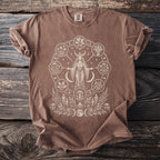 Brown t-shirt with a cream circle design featuring a moon-horned woman and symbols of nature.