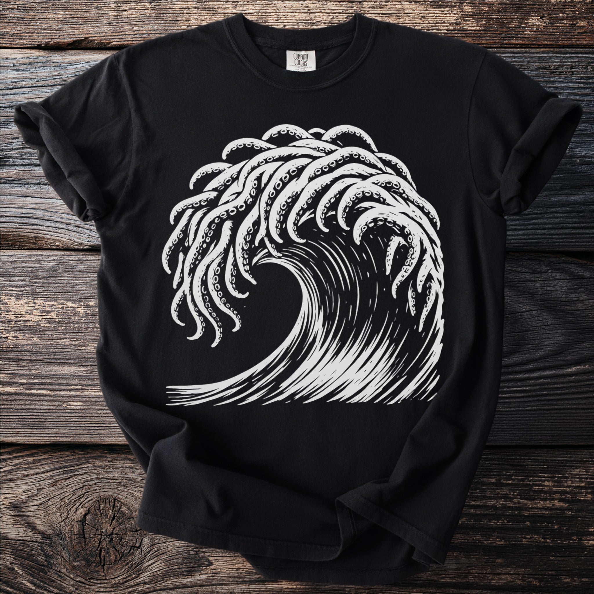 Black t-shirt with white graphic of kraken tentacles and a wave.