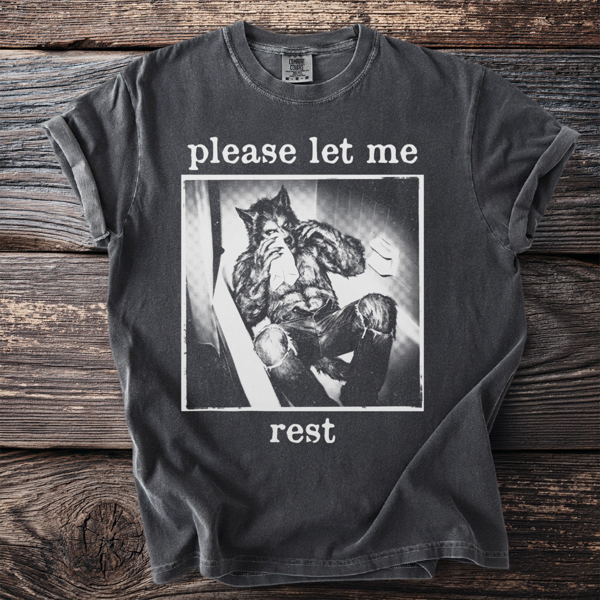 Dark grey t-shirt with text "please let me rest" and werewolf graphic.