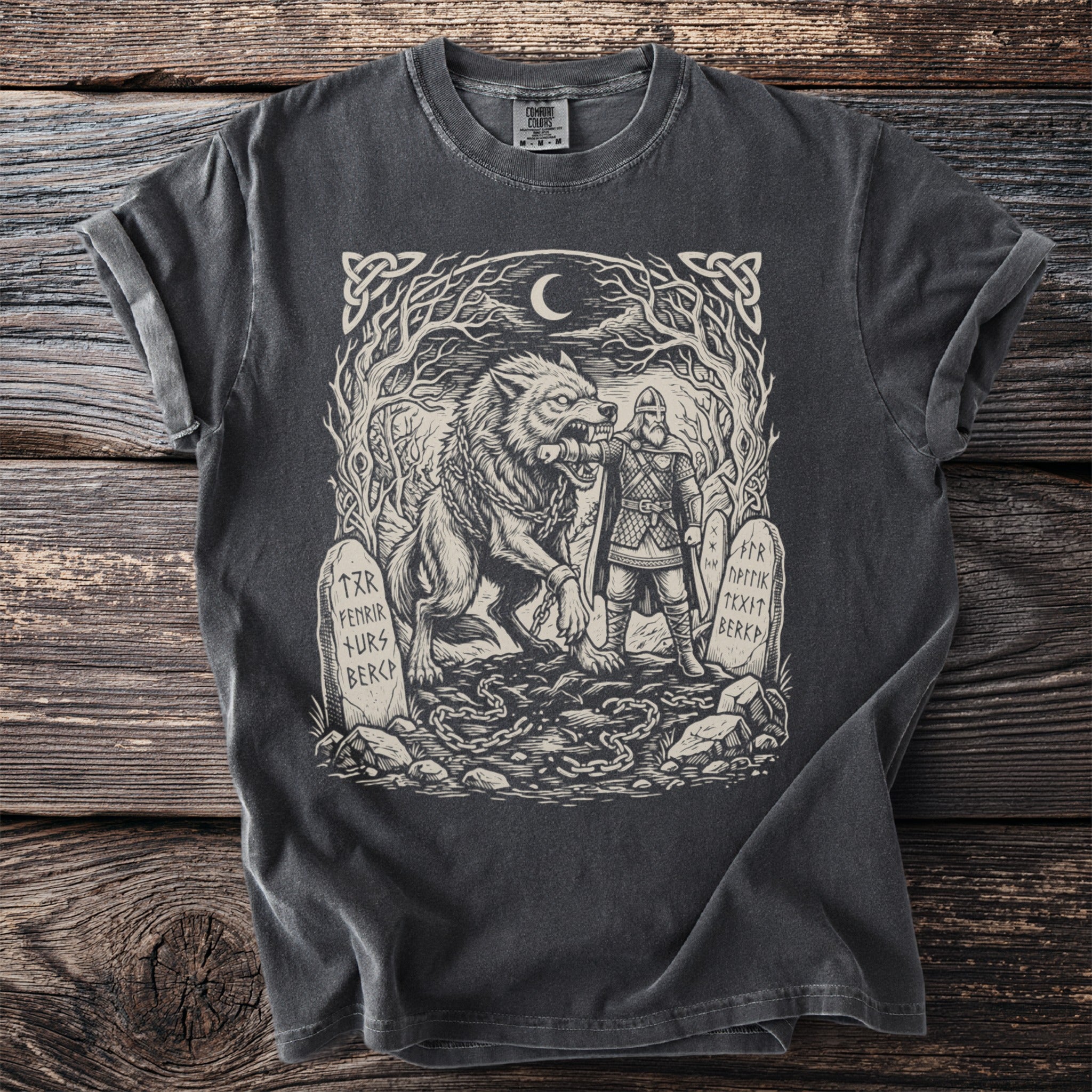 T-shirt with Viking illustration of a wolf and a warrior with runes on tombstones.