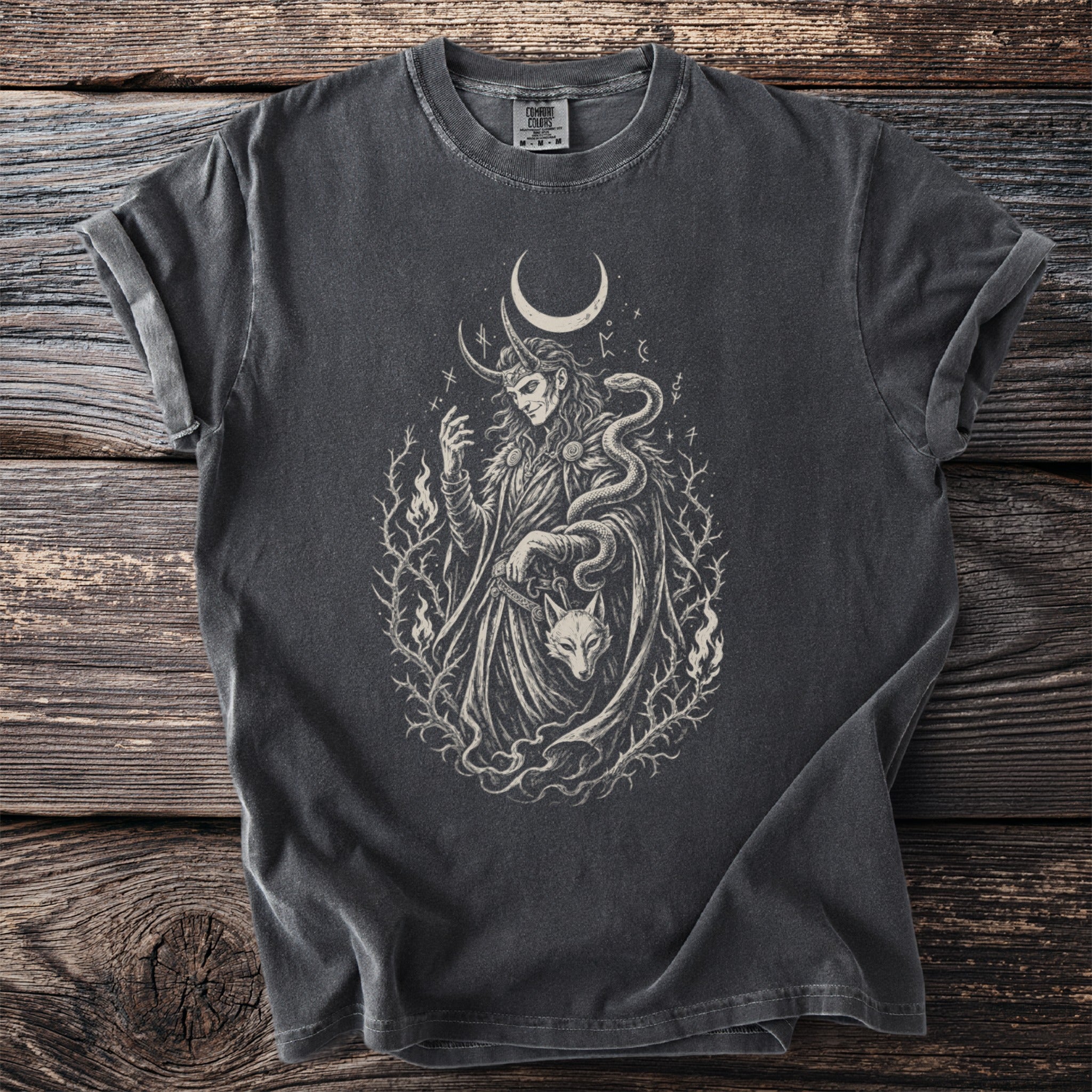 Dark t-shirt featuring a Norse-inspired illustration with a horned figure, snake, and wolf.