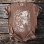 Brown t-shirt with werewolf and cloaked figure design in oval frame.