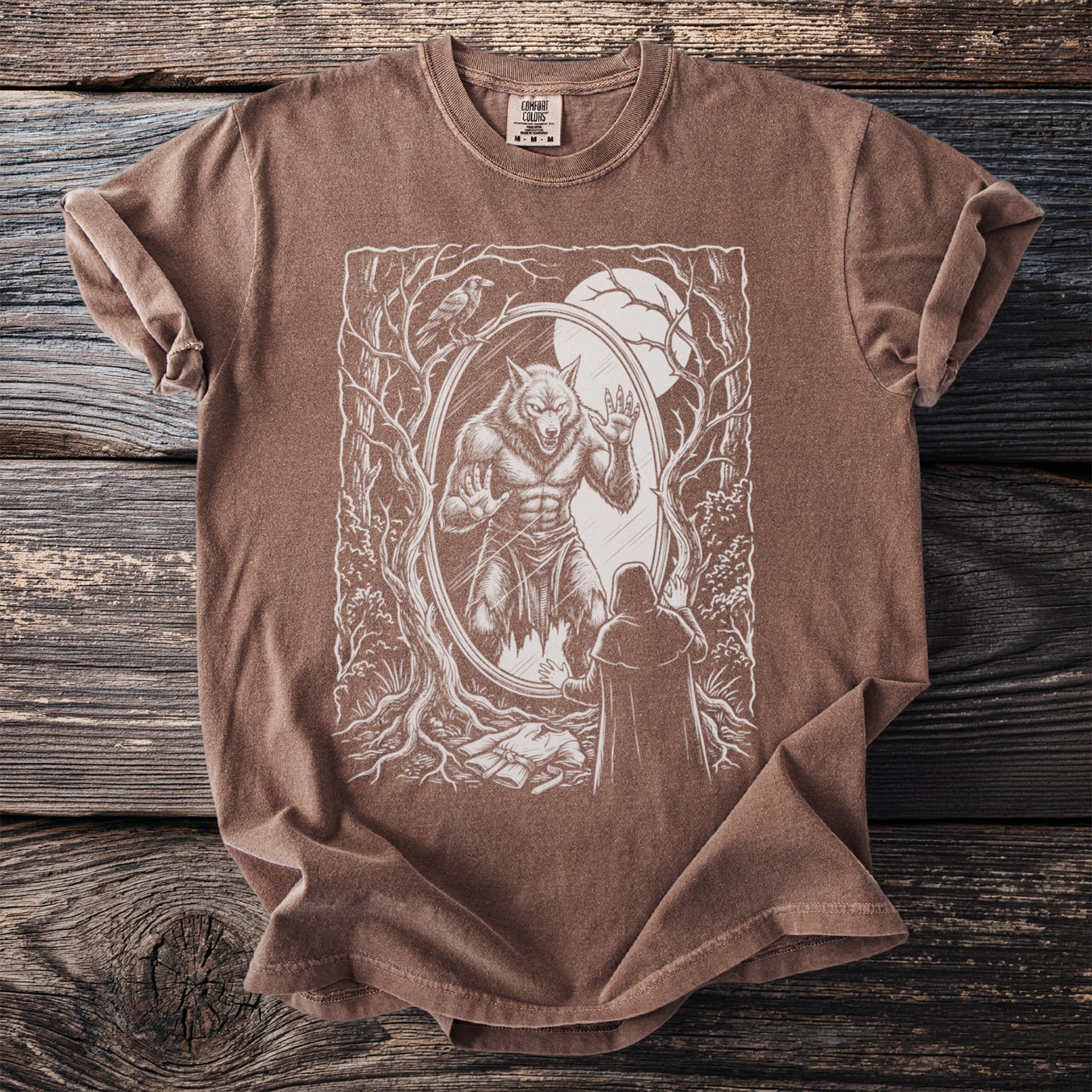 Brown t-shirt with werewolf and cloaked figure design in oval frame.