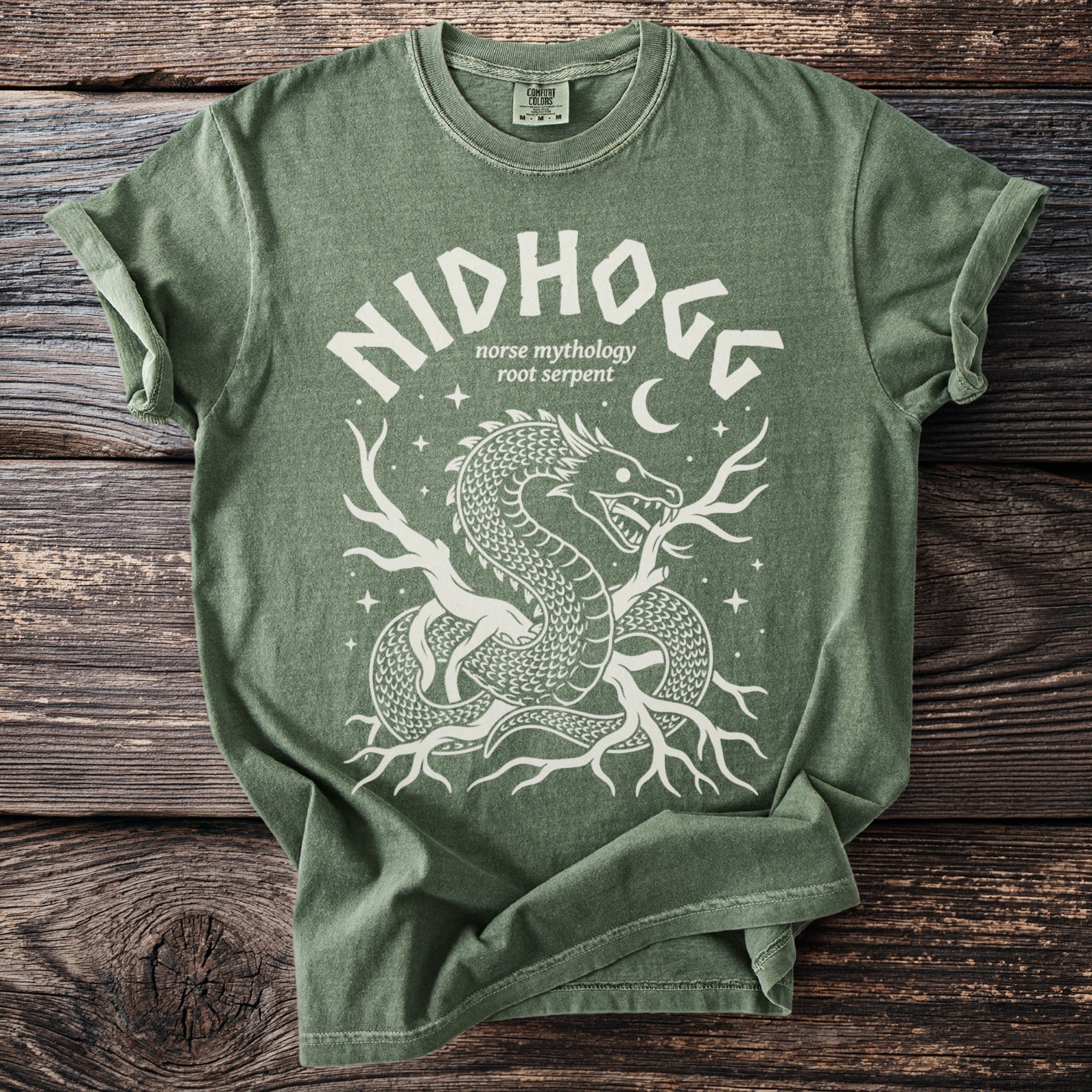 Green t-shirt with white graphic of Nidhogg, the Norse mythology root serpent.