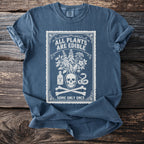 Blue t-shirt with "ALL PLANTS ARE EDIBLE SOME ONLY ONCE" text and botanical skull graphic.