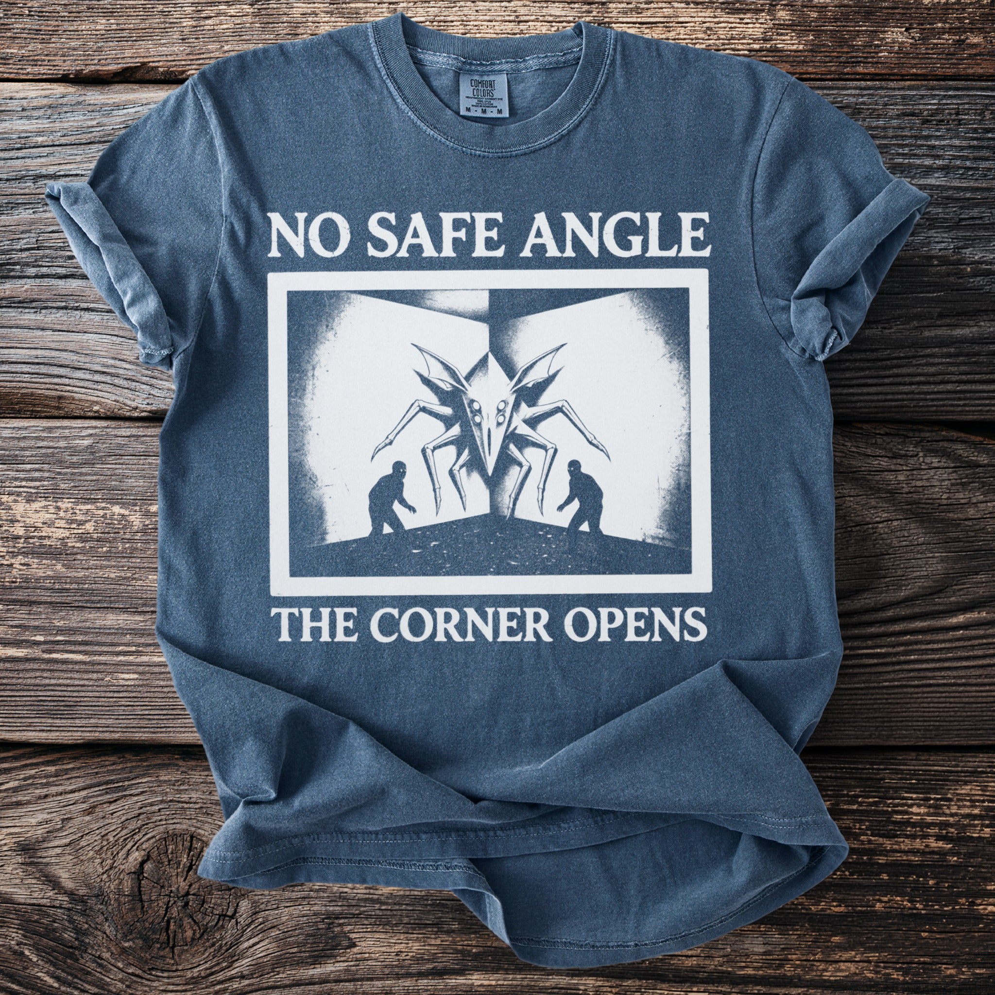 T-shirt with "NO SAFE ANGLE THE CORNER OPENS" and a monster design.