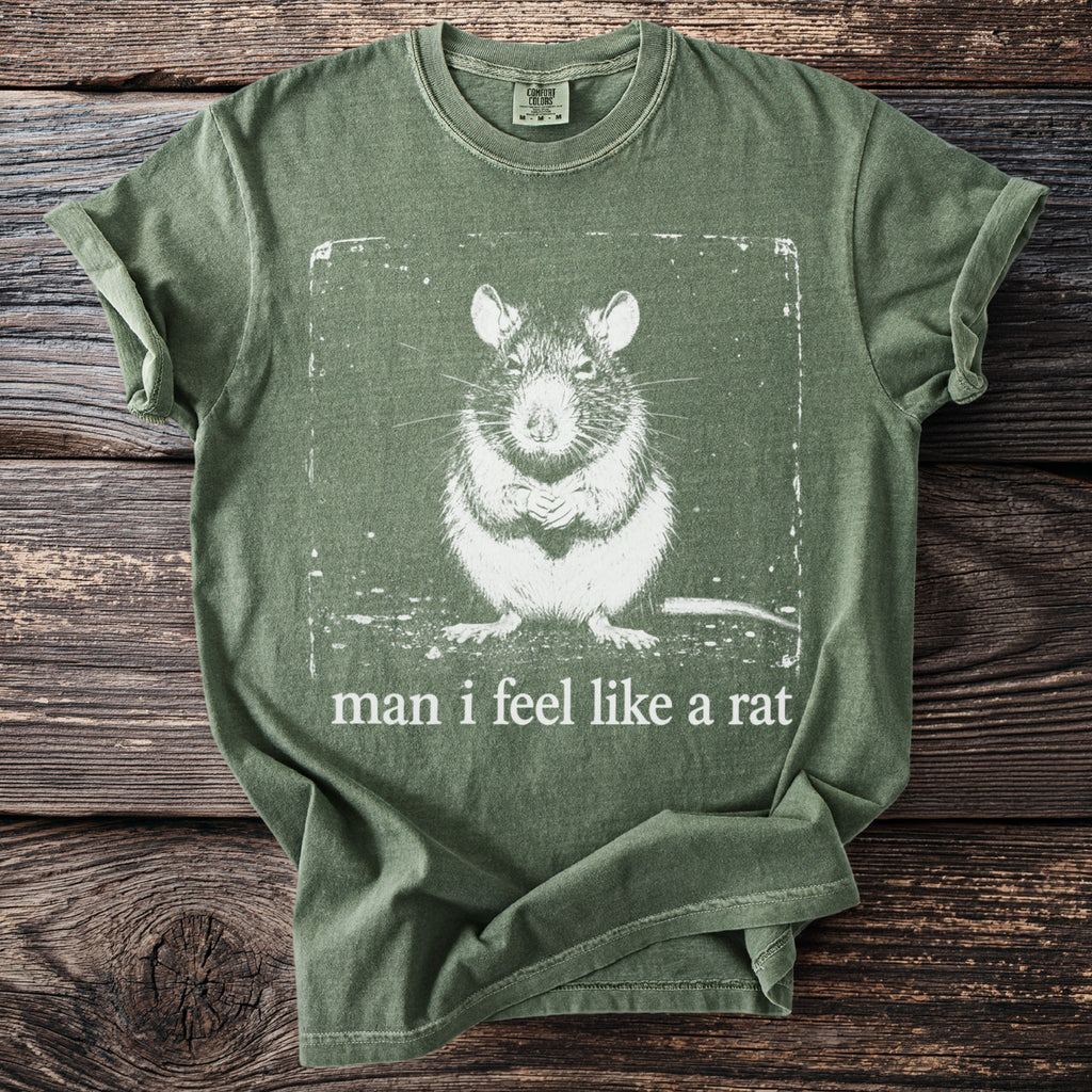 Green t-shirt with white graphic of a rat and text "man i feel like a rat".