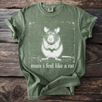 Green t-shirt with white graphic of a rat and text "man i feel like a rat".