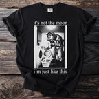 Black t-shirt with a graphic of a werewolf doing laundry and text "it's not the moon i'm just like this".