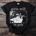 Black t-shirt with white text "girls will be girls" and a vintage image.