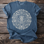 Blue t-shirt with cream circular pagan-themed print featuring a goddess, animals, and plants.