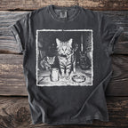 T-shirt with graphic print of three cats, one smoking amidst an ashtray and cans.