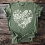 Green t-shirt with white heart design of two moths and floral accents
