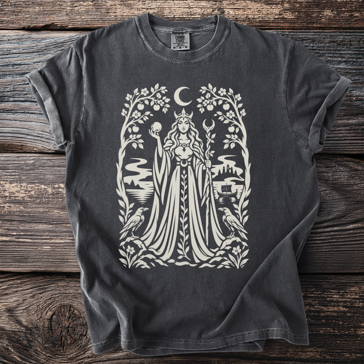 Dark grey t-shirt with a white graphic of a queen, moon, trees, birds, and a ship.