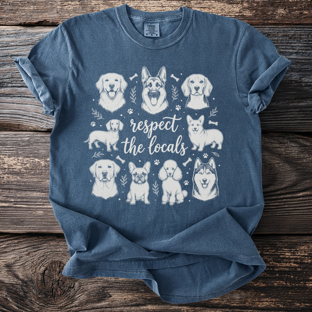 T-shirt with sketch art of various dog breeds and text "respect the locals."