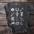 T-shirt featuring a mystical design of a horseshoe, key, broom, and cat.