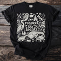 Black t-shirt with swamp animals and "respect the locals" text.