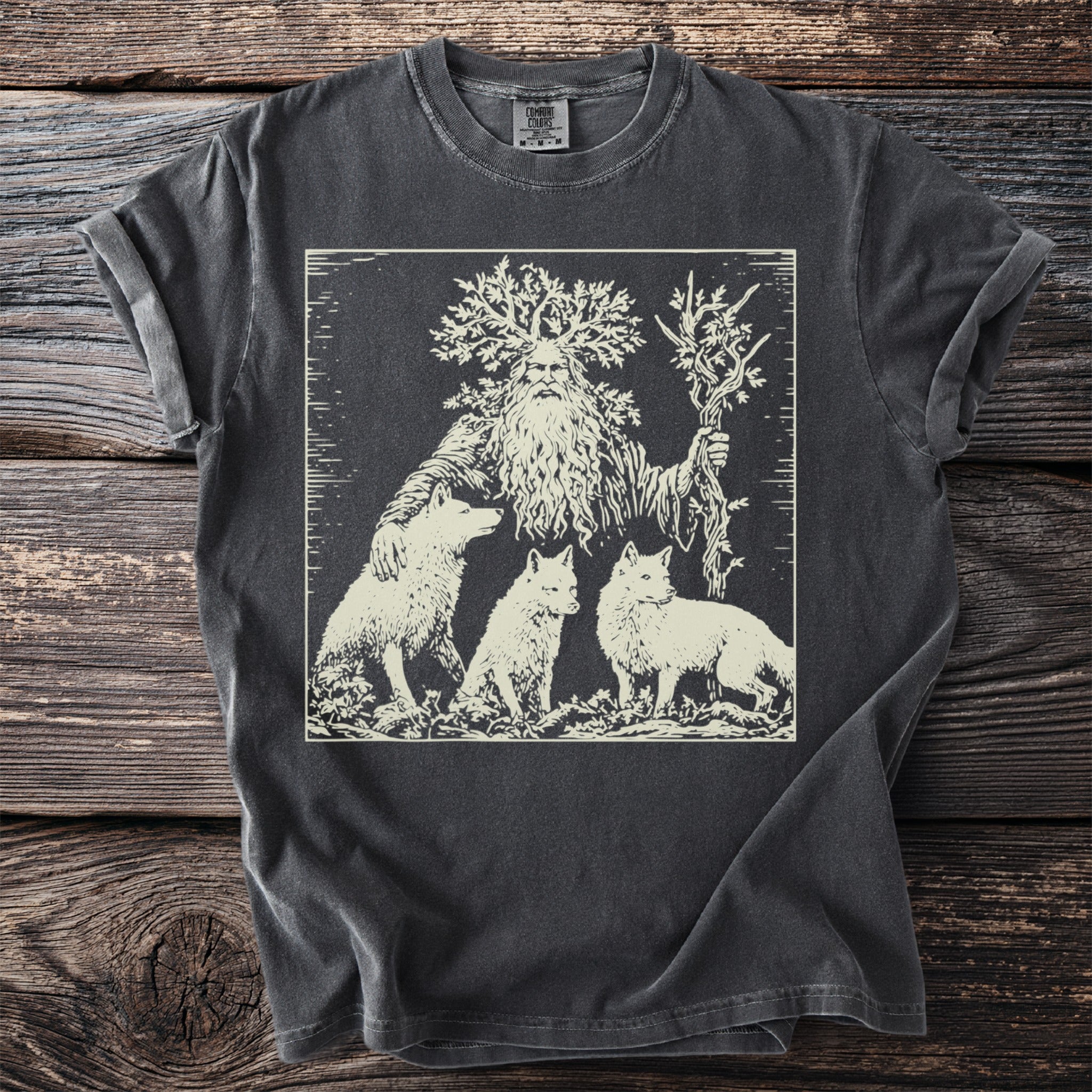 A bearded man with a tree for a head stands with three wolves.