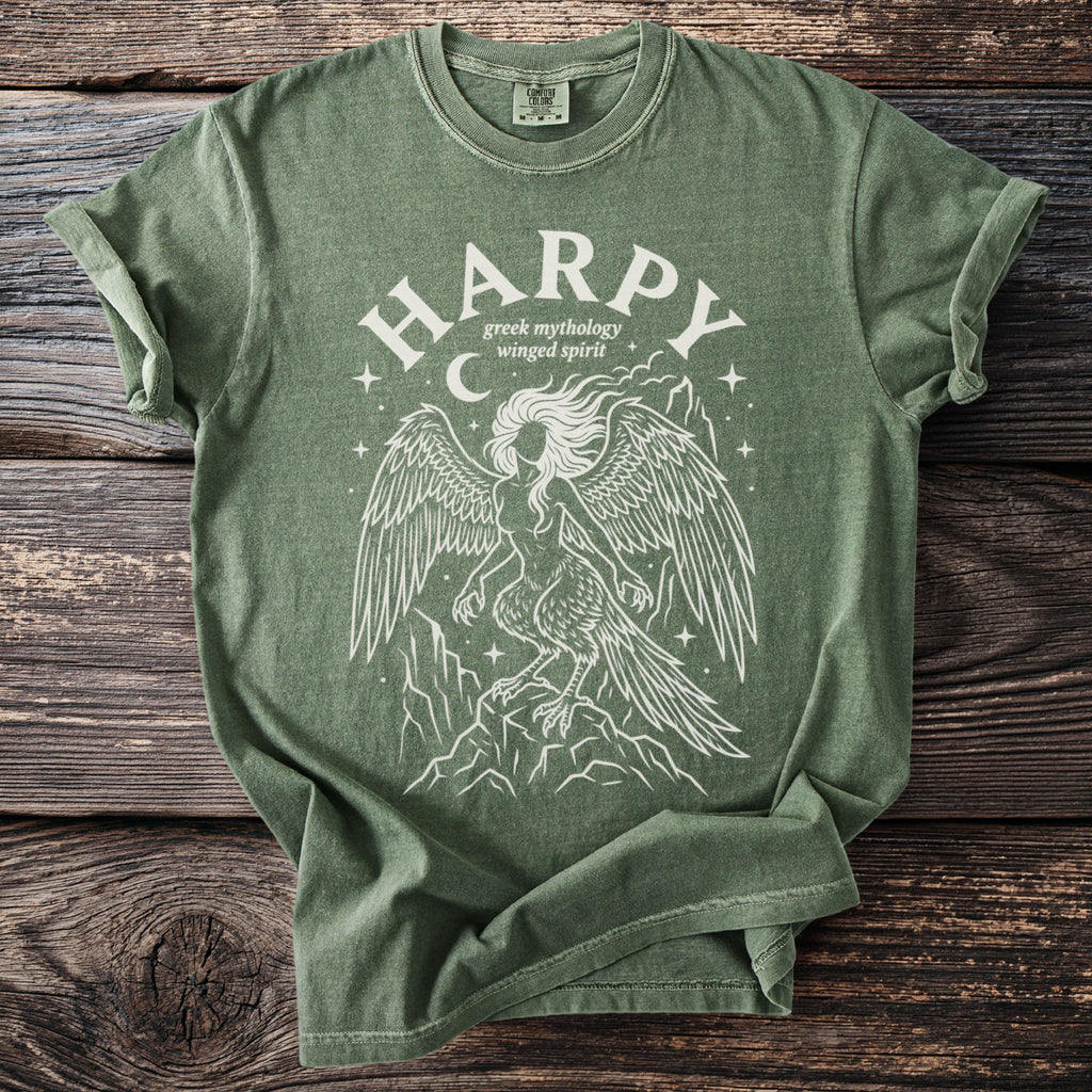 Green t-shirt with white "HARPY greek mythology winged spirit" design and a harpy illustration.