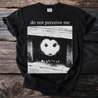 Black t-shirt front graphic with possum peeking out and text "do not perceive me".