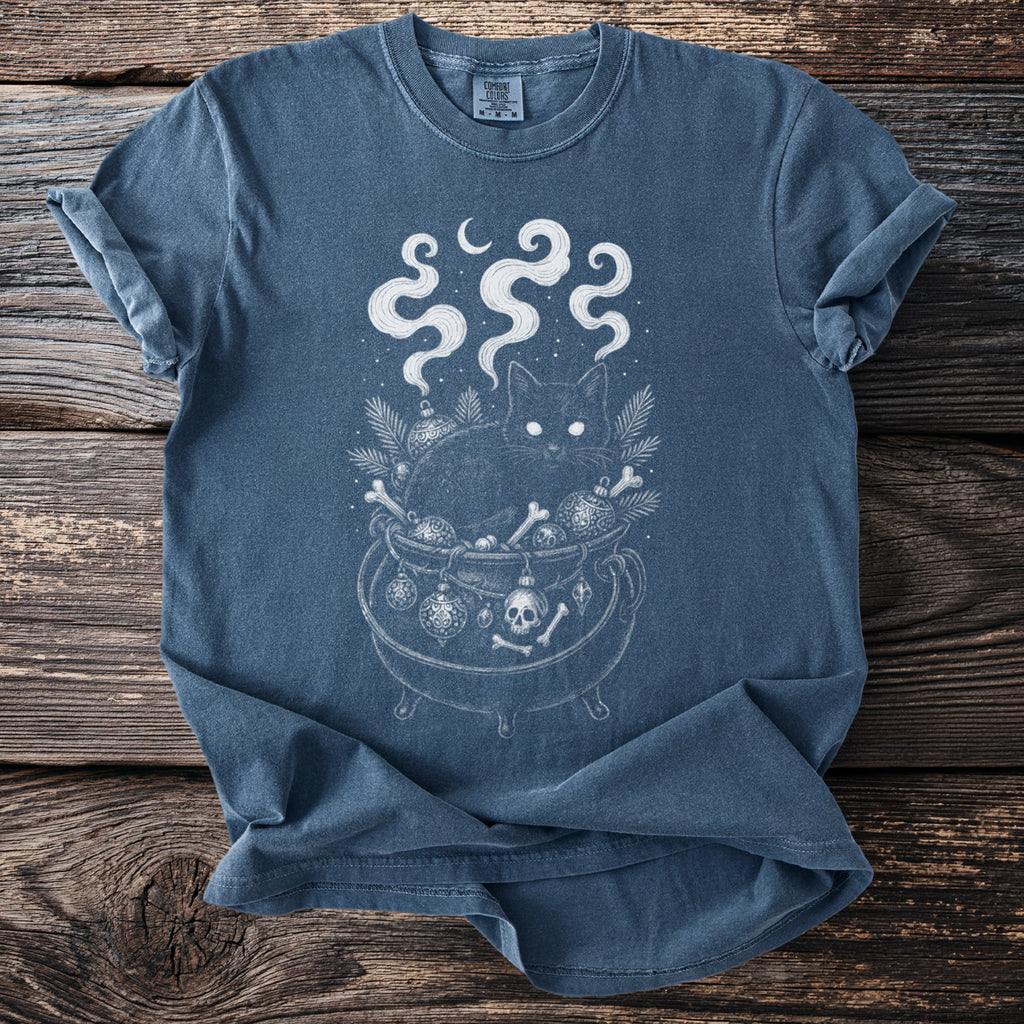 Black cat in a cauldron with skulls, bones, ornaments and smoke under a moon.