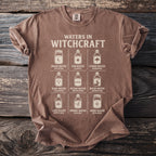 T-shirt with "Waters in Witchcraft" graphic showing nine types of water in jars.