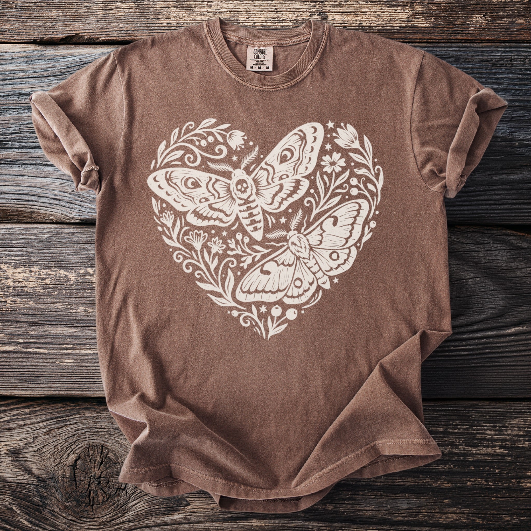 Brown t-shirt with white moth and floral heart print.