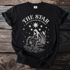 Black t-shirt with "The Star tarot card arcana hope celestial" text and tarot imagery.