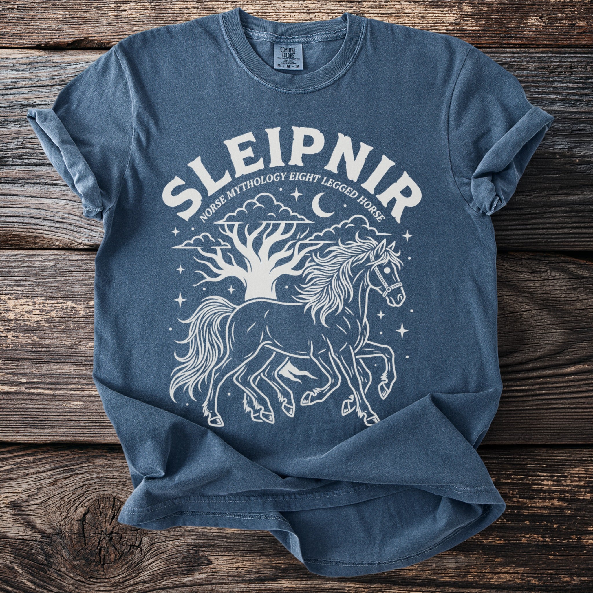 Blue t-shirt with white graphic of Sleipnir, Norse mythology eight legged horse.