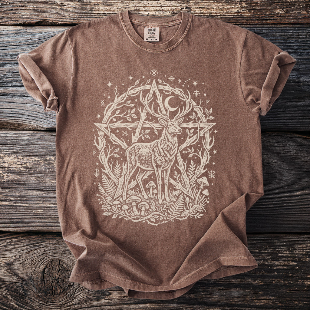 Brown t-shirt with white graphic of a deer surrounded by a pentagram, moon, plants, and symbols.