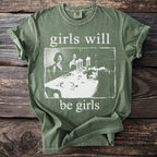 Green t-shirt with white text "girls will be girls" and a vintage image.