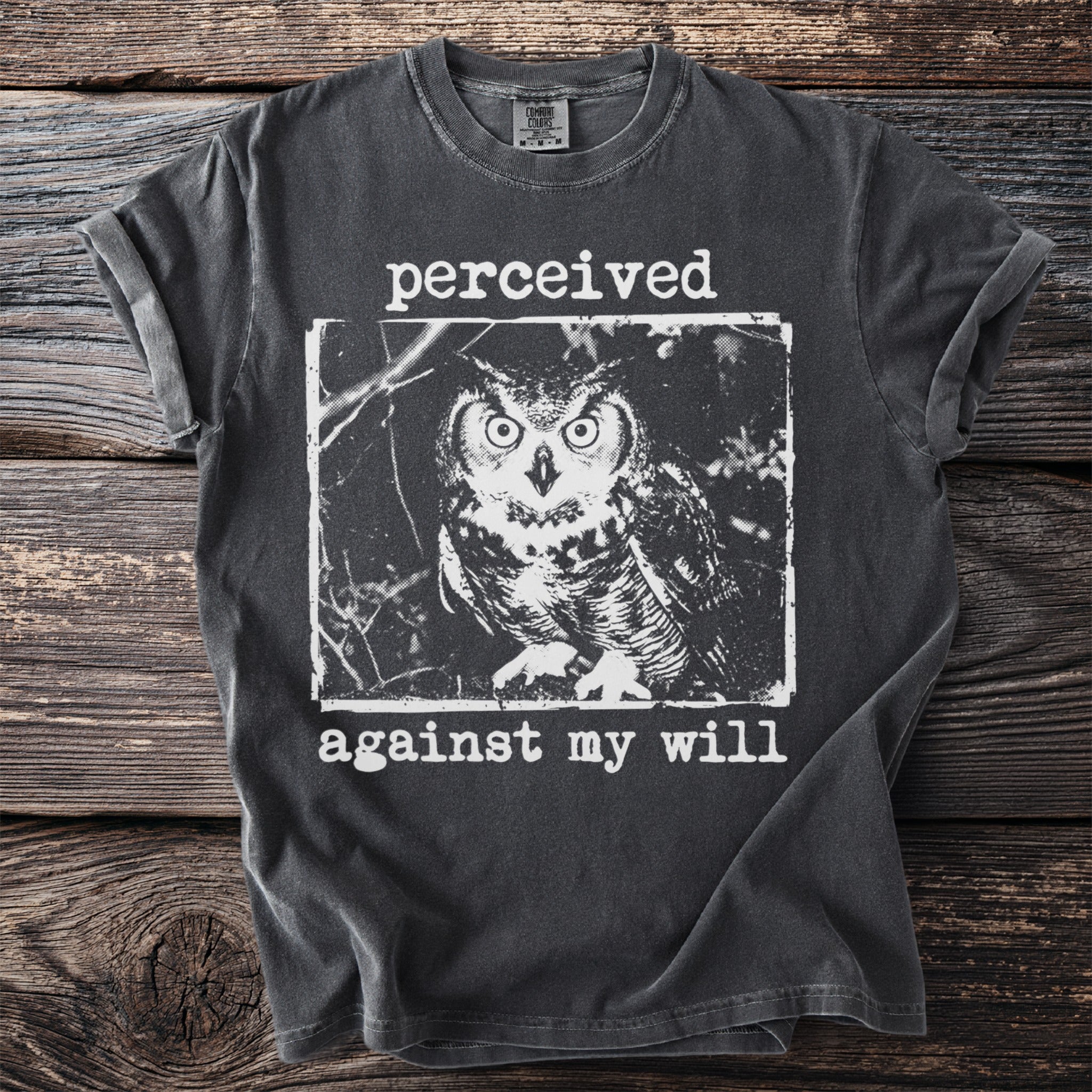 Dark gray t-shirt with a black and white graphic of an owl and text.