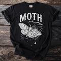 Black t-shirt with white moth graphic and "MOTH" text.