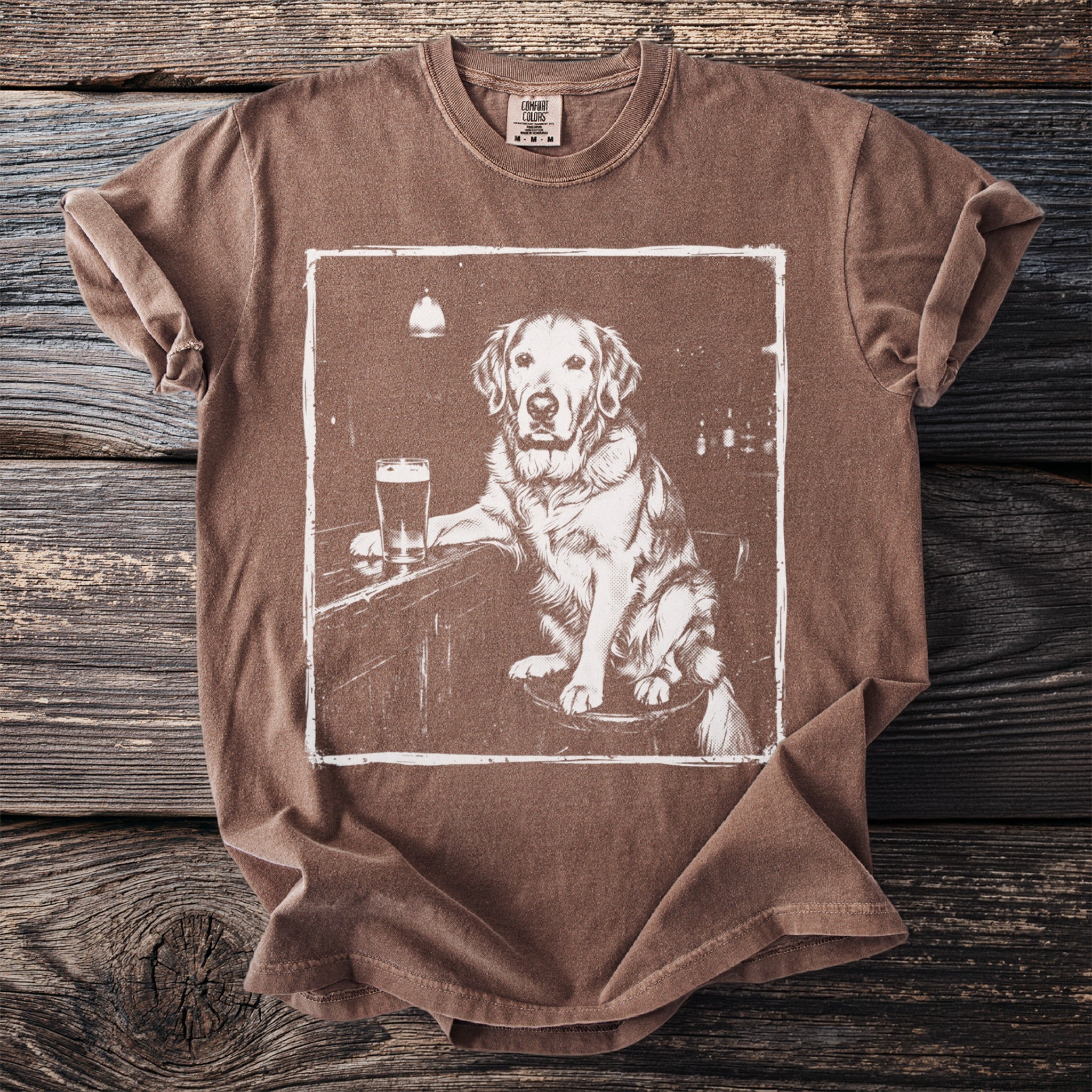 Brown t-shirt with a vintage illustration of a Golden Retriever sitting at a bar with a beer.