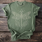 Green t-shirt with a white celestial dragonfly and floral design.