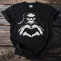 Black t-shirt with a white graphic of a gorilla forming a heart with its hands.