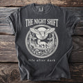 Charcoal t-shirt with "The Night Shift" and a circular forest scene with animals.
