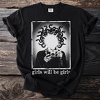 Black t-shirt with graphic of Medusa holding a camera and text "girls will be girls".