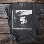 Dark t-shirt with a black and white image of a rabbit and text.
