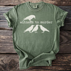 Green t-shirt with white text "Witness to Murder" and four white crows.