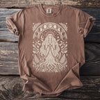 Brown t-shirt with a tree goddess and moon phases graphic print.