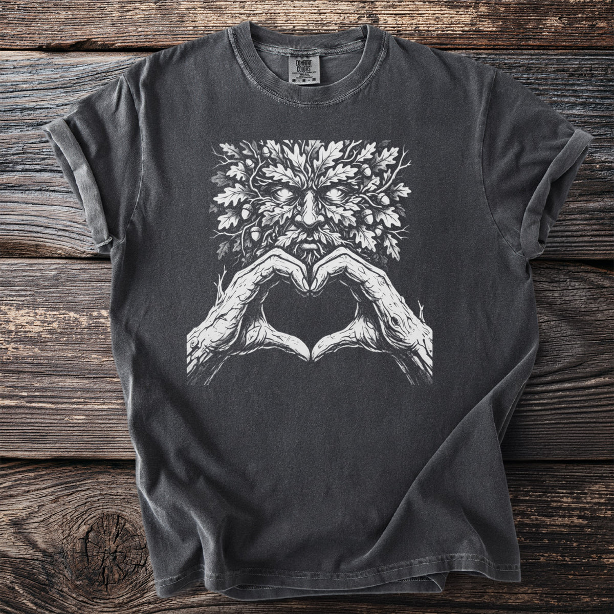 Dark grey t-shirt with a white graphic of a green man and heart-shaped hands.