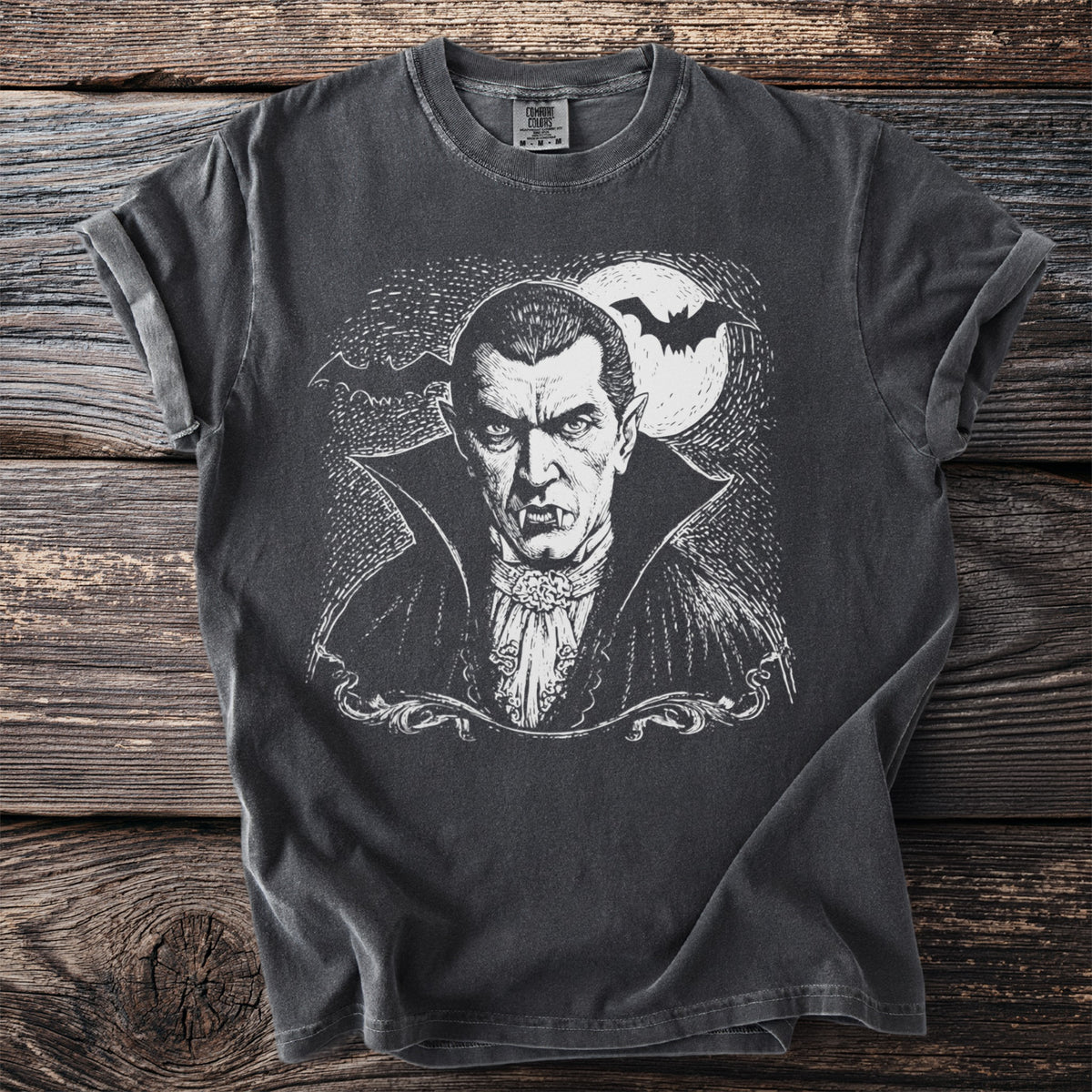 Dark grey t-shirt with a vintage illustration of a vampire with fangs and bats.