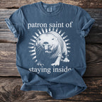 Blue t-shirt with a naked mole rat graphic and text "patron saint of staying inside".